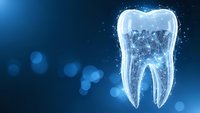 Digital tooth structure with glowing outline on blue background with bokeh lights for dental healthcare and oral hygiene concepts.
