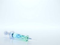 Medical syringe with DNA helix molecule inside, isolated on white background. Suitable for healthcare, genetics, biotechnology, and medical research presentations.