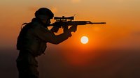 Silhouette of armed soldier with rifle against dramatic orange sunset sky, military operation concept for defense and security themes.