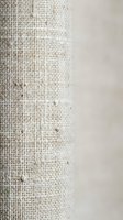Natural burlap fabric texture meets smooth white surface creating rustic contrast for organic design projects and eco-friendly branding materials.