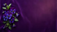 Purple pansy flowers with green leaves on elegant violet silk fabric background with copy space for text and design projects.