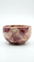 Handcrafted ceramic bowl featuring mauve and cream watercolor floral patterns, isolated on white background. Perfect for home decor, tableware design, and product photography.