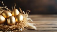 Golden painted Easter eggs nestled in natural straw nest on rustic wooden background with soft lighting and copy space, festive holiday composition.