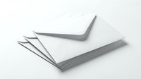 Stack of white paper envelopes on a light background, symbolizing mail, correspondence, and communication for business or personal use.