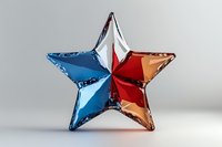 Metallic star shape divided into red, white and blue sections on neutral background, glossy reflective surface creates modern patriotic decorative element.