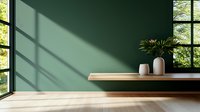 Minimalist interior with wooden shelf against green wall, window light casting geometric shadows, white ceramic vases and tropical plant creating zen atmosphere.