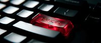 Red glowing keyboard key with services text on black computer keyboard for business technology and customer support concepts.