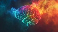 Glowing brain silhouette with colorful smoke effect, neon blue and orange flames on dark background. Creative concept for mind power and consciousness.