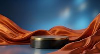 Elegant black podium with golden rim surrounded by flowing orange silk fabric against blue gradient background for luxury product display and presentation.