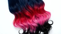 Ombre hair with dark roots transitioning to vibrant red and hot pink tones, styled in loose waves. Isolated on white background, ready for beauty, fashion, and salon design projects.