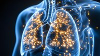 Glowing human lungs with golden light particles inside transparent blue body silhouette on dark background, respiratory system visualization.