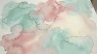 Soft watercolor background with pastel green and pink hues blending organically. Abstract artistic texture for creative projects and design elements.
