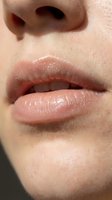Close-up of full lips with natural gloss and soft texture on fair skin, showcasing lip care, beauty makeup, and cosmetic products for skincare advertising.