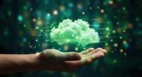 Hand holding glowing green cloud with digital network connections and sparkles representing cloud computing technology and data storage solutions.