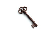 Vintage copper skeleton key with ornate bow design and aged patina isolated on white background, suitable for antique and steampunk design projects.