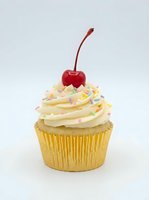 Vanilla cupcake with white frosting, colorful sprinkles, and a red cherry on top, isolated on white background for bakery, dessert, and confectionery design projects.