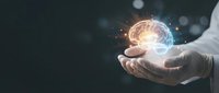 Human hand holding glowing brain with neural network connections and light effects on dark background for artificial intelligence concepts.