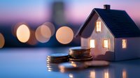 Miniature house model with stacked coins at twilight representing real estate investment, mortgage planning, property financing and home buying savings concept.
