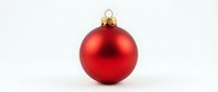 Red Christmas ornament ball with gold cap isolated on white background for holiday decorations and festive designs.