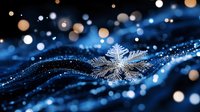 Delicate snowflake crystal on dark blue background with glowing bokeh lights and magical sparkles. Winter seasonal macro photography with dreamy atmosphere.