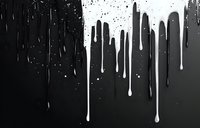 White paint drips flowing down on black background creating dramatic contrast effect with splatter texture and vertical streaks for artistic design projects.