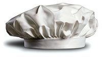 White chef hat with puffy crown and elastic band isolated on transparent background for culinary design projects and restaurant branding materials.