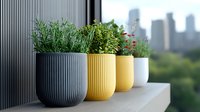 Modern urban garden with fresh herbs and flowers in colorful ceramic planters on balcony ledge against city skyline background, showcasing contemporary container gardening.