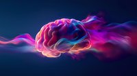 Glowing brain surrounded by vibrant pink and blue smoke effect against dark background, representing mind power, consciousness and creative thinking.