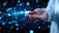 Magical glowing blue particles flowing from red crystal in outstretched hand against dark background, creating mystical ethereal atmosphere for fantasy designs.