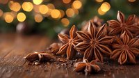 Star anise pods on rustic wooden surface with warm golden bokeh lights in background, aromatic spices and festive holiday mood for seasonal cooking.