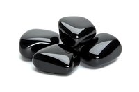 Polished black obsidian stones arranged on white background, showcasing smooth surface and natural glossy finish. Spiritual healing crystals for meditation practice.