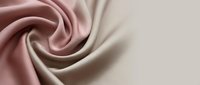 Luxurious silk fabric with elegant swirl pattern in soft pink and cream tones, perfect for fashion design, textile backgrounds, and premium material concepts.