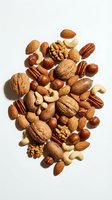 Mixed nuts collection with almonds walnuts cashews pecans hazelnuts on white background for healthy snacking and cooking ingredients.