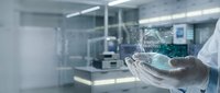 Healthcare professional holding holographic artificial intelligence interface in modern medical laboratory environment for futuristic technology applications.