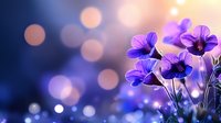 Purple wildflowers blooming in soft golden sunlight with dreamy bokeh background creating peaceful spring garden atmosphere for wellness and nature themes.