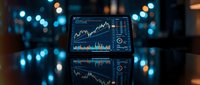 Financial trading charts and graphs displayed on computer screen with bokeh city lights background for investment analysis and market research.