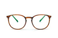 Round brown tortoise eyeglass frames with green temple tips on white background, classic vintage style optical glasses isolated for optical retail and eyewear design.