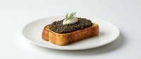 Toasted bread slice topped with caviar and butter curl garnish on white plate, gourmet appetizer for fine dining and luxury food concepts.