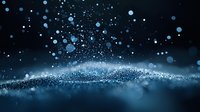 Magical blue glowing particles floating in dark space with bokeh light effect and shimmering dust creating ethereal atmospheric background.