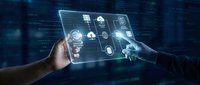 Businessman using transparent digital tablet with cloud computing icons and data analytics interface for modern technology solutions.