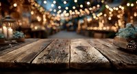 Empty wooden table with blurred Christmas market lights background for holiday product display and festive seasonal advertising campaigns.