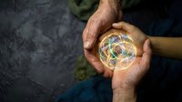Diverse hands holding glowing sphere with colorful light trails, representing teamwork, innovation, and global connection for business and technology concepts.