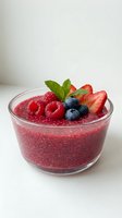 Healthy chia seed pudding with fresh berries and mint in glass bowl on white background for breakfast dessert recipes and clean eating lifestyle.