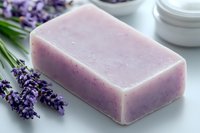Handmade lavender soap bar with fresh purple flowers on light background, natural skincare product for aromatherapy and relaxation spa treatments.