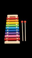 Colorful wooden xylophone toy with rainbow bars and two mallets, isolated on transparent background. Great for clipart, stickers, t-shirt design, and print on demand.