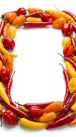 Colorful hot peppers and bell peppers arranged in a frame border with white center space, featuring red, yellow, and orange varieties for food and culinary designs.