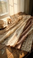 Cozy morning scene with vintage lace fabric, teacup and dried flowers on wooden table by sunny window creating warm atmospheric home interior.