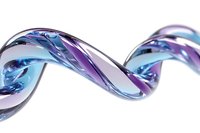 Flowing liquid wave with iridescent purple and blue colors creating dynamic motion on white background for modern design projects.