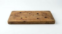 Vintage wooden board with knots and weathered surface, isolated on white background for design projects and product mockups.