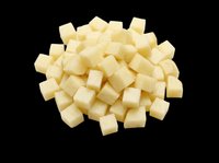 Diced white cheese cubes pile isolated on transparent background, ready for food clipart, print on demand, stickers, T-shirt design, and sublimation projects.